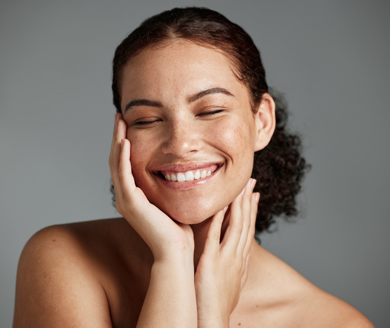 Woman demonstrating defined jawline and cheek contours
